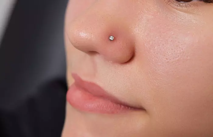 A woman with a healed piercing