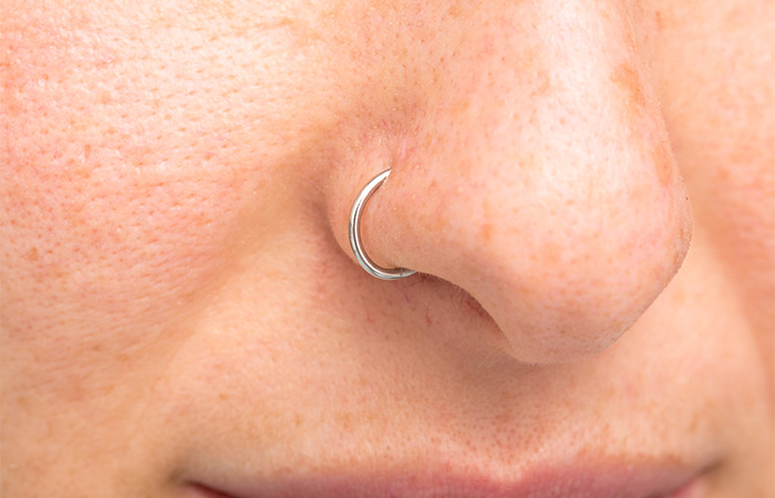 A woman with a simple nose ring piercing jewelry