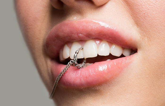 A woman with a tooth piercing