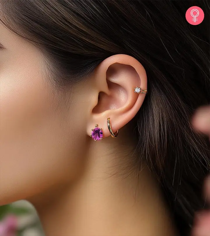 A woman with different types of ear piercings