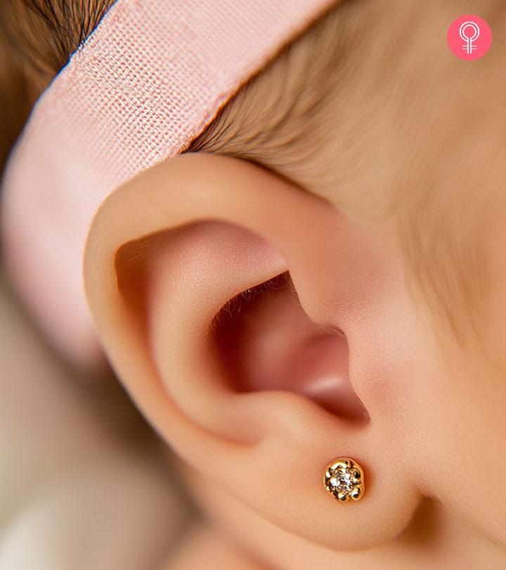 A baby with a pierced ear