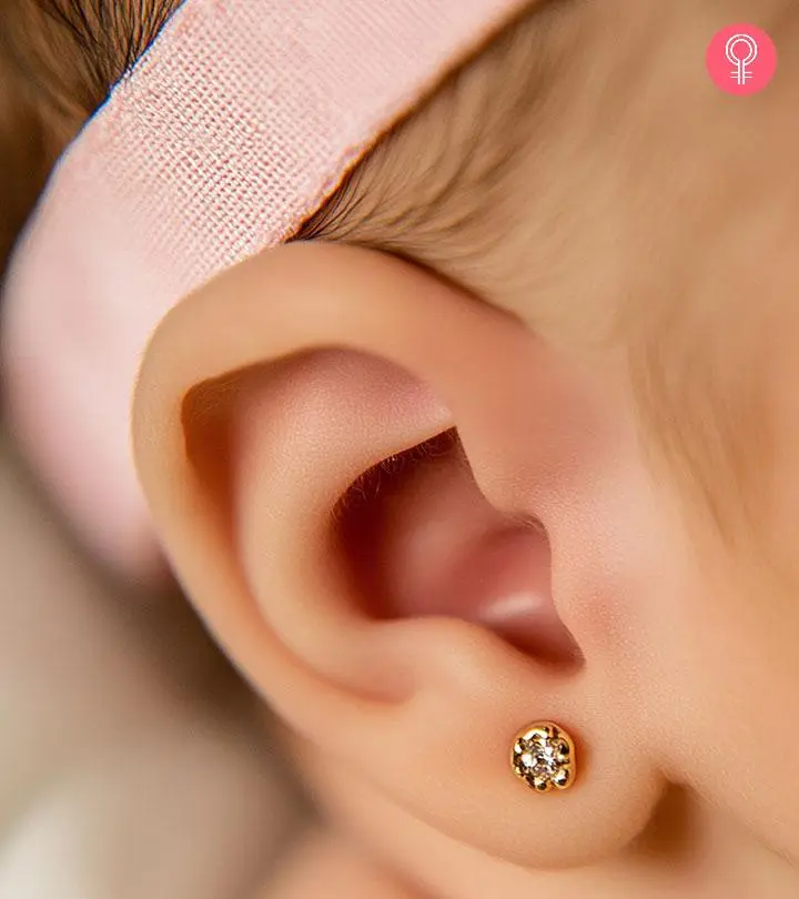 A baby with a pierced ear