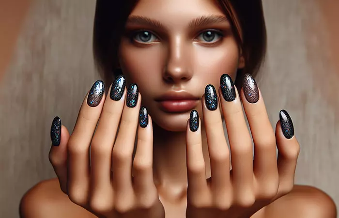 Black with holographic glitter nail design