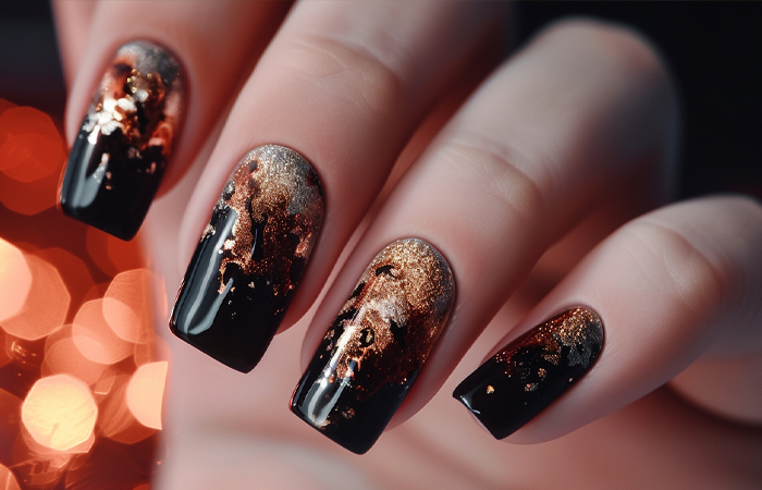 Black nail polish with gold marbling