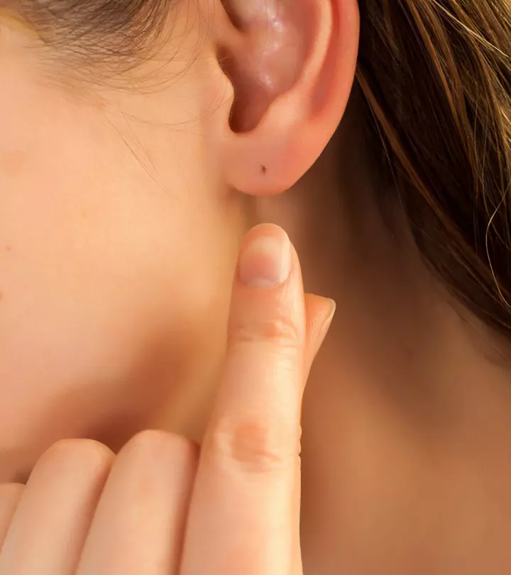 A woman with an ear lobe piercing