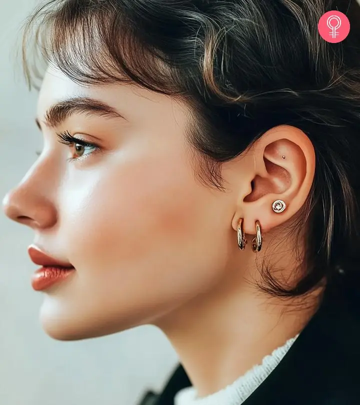 A woman with multiple ear piercings