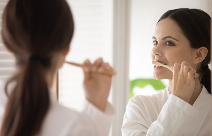 Woman brushing her teeth