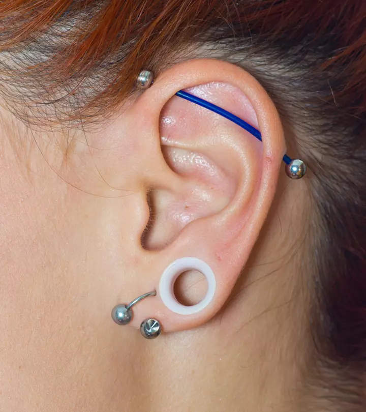 A woman with an industrial piercing