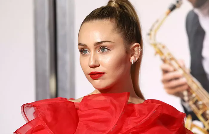 Miley Cyrus flaunts her curated ear piercings