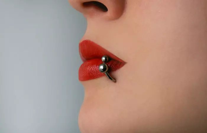 Side labret lip piercing