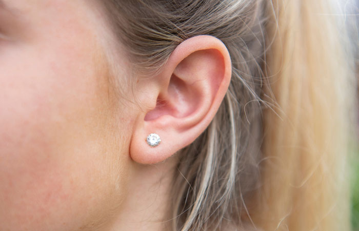 A woman with a standard lobe piercing