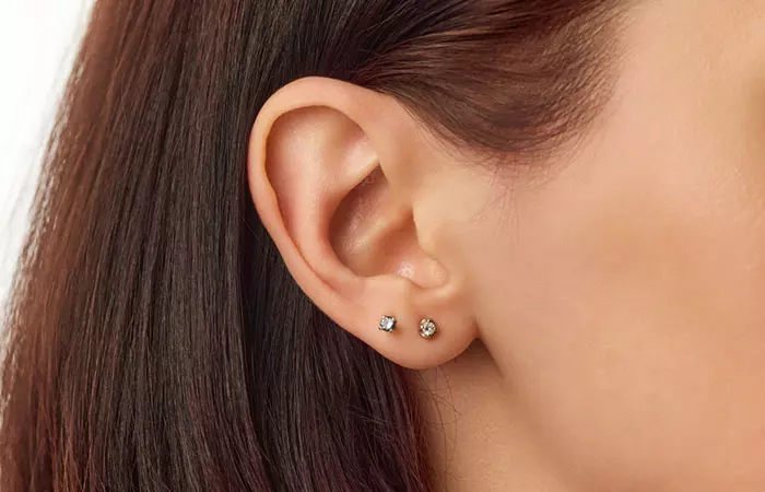 Starter diamond studs on a girl’s ear