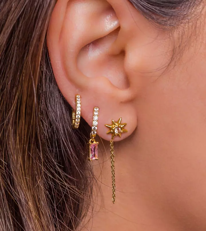 A woman with different types of ear piercings