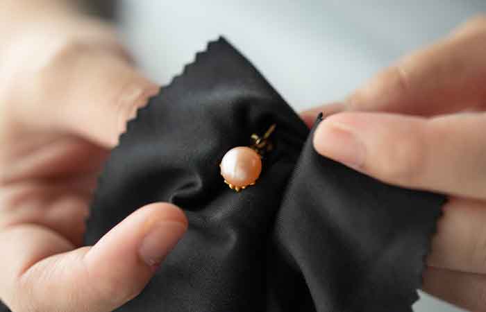 A person cleaning their nose stud