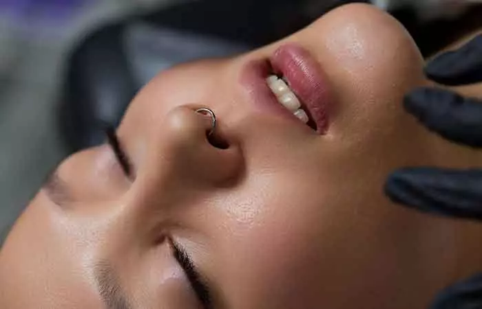 A woman with a healed nose piercing