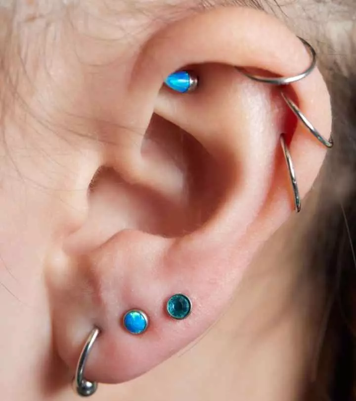 Woman with rook piercing and other piercings
