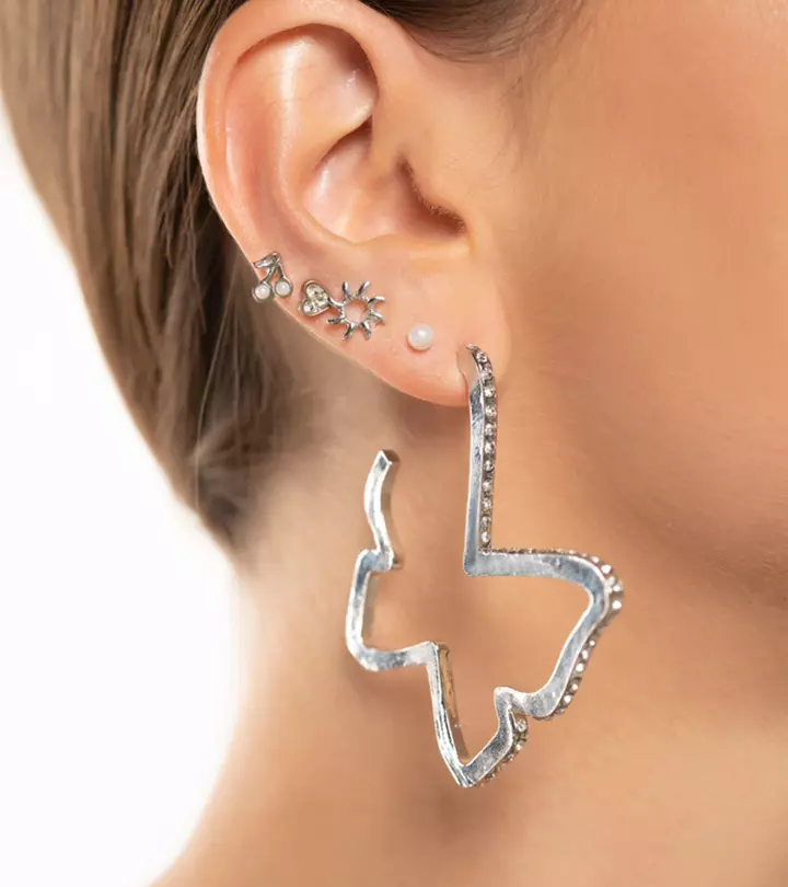 Woman wearing different metal piercing jewelry