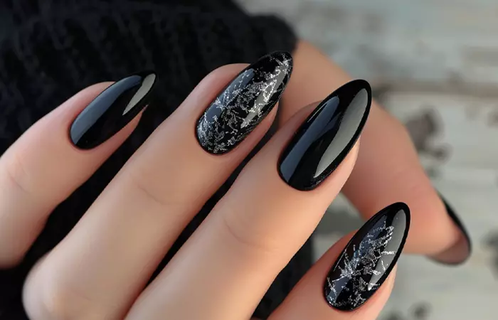 Black nail design on almond shaped nails