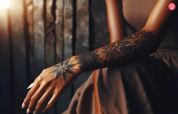 Woman flaunting a sleeve of star tattoos on her forearm