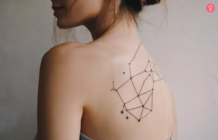 Woman with a star constellation tattoo on her back