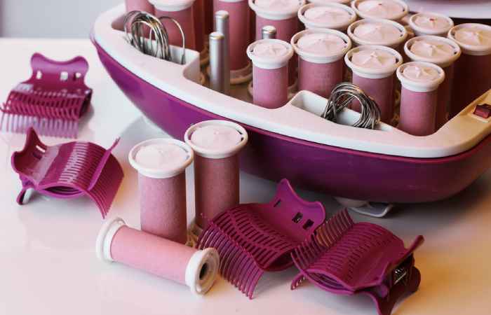 A box of hot rollers on a table