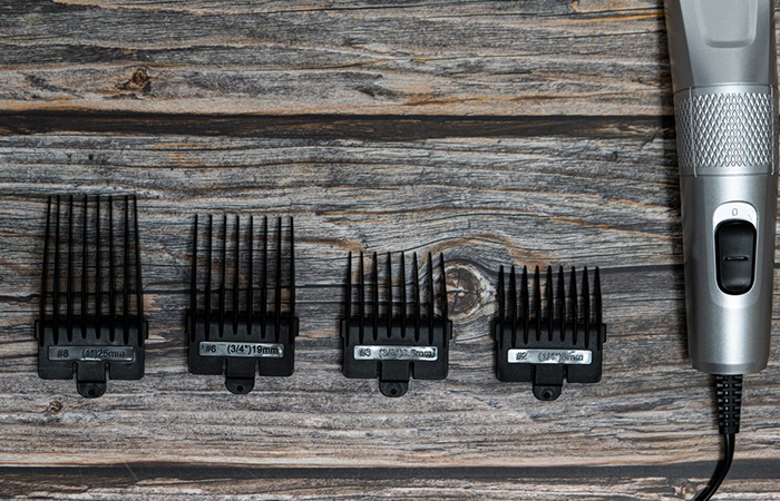 A hair clipper with guard attachments