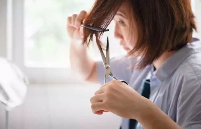A woman cutting hair