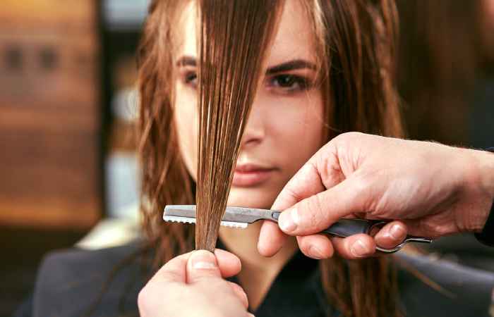 A woman getting face-framing layers