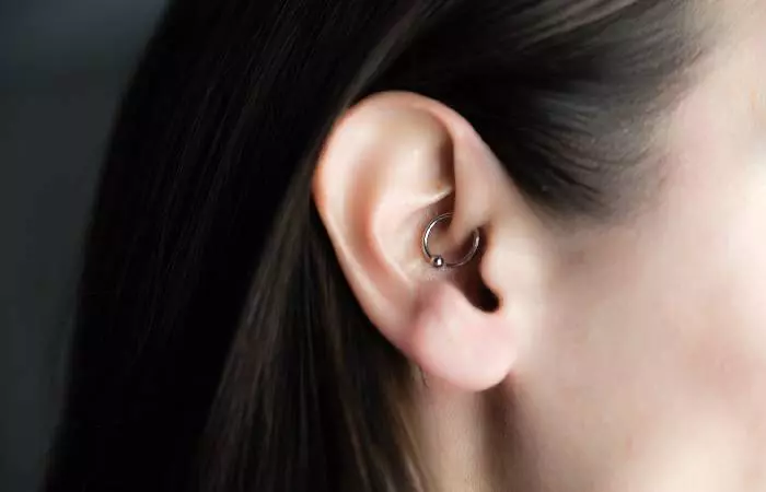 A woman with a daith piercing
