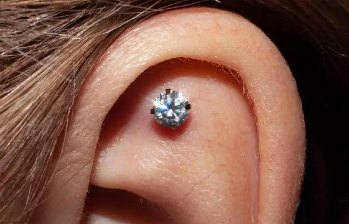 A woman with a flat helix piercing