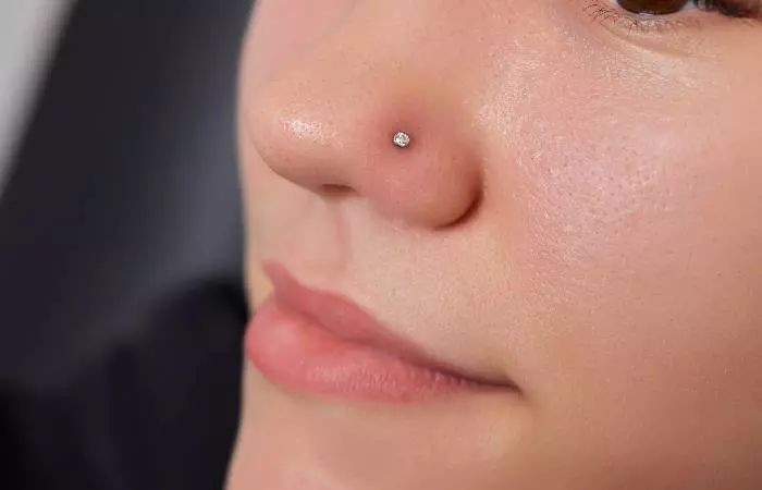 A woman with a nostril piercing