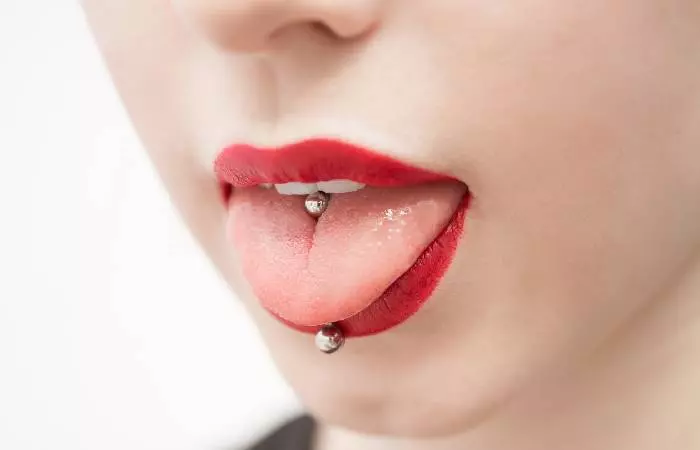 A woman with a tongue piercing