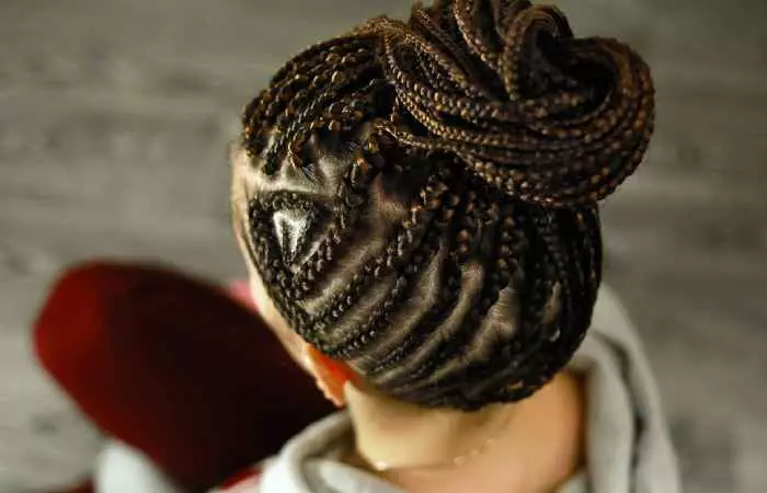 A woman with cornrows hairstyle