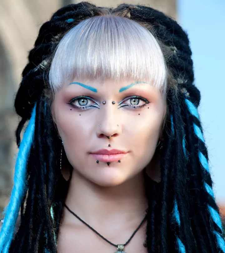 A woman with multiple face piercings