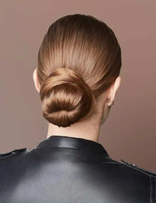  A woman with neatly tied military hair bun 