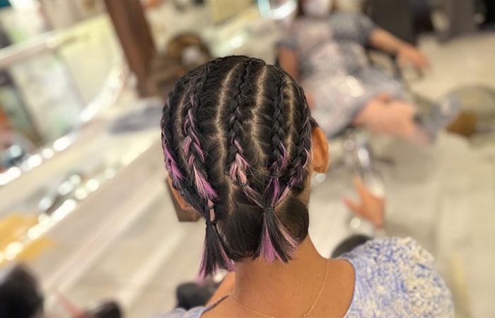 Back view of a girl with Cornrow Pigtails