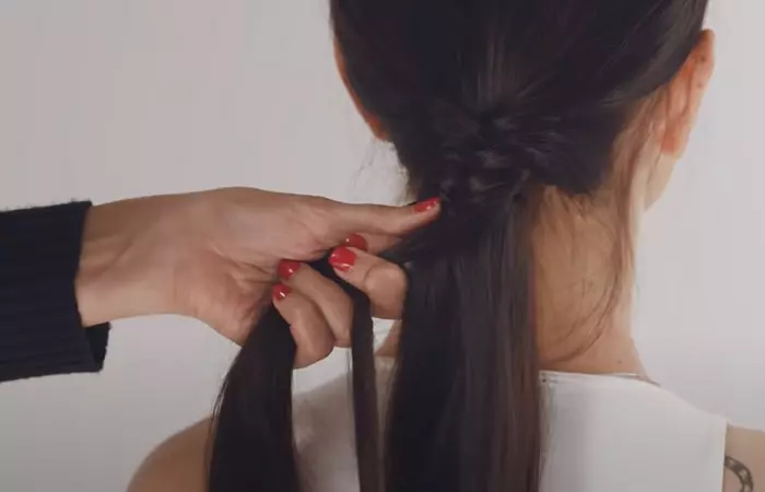 Fishtail braiding by hairdresser