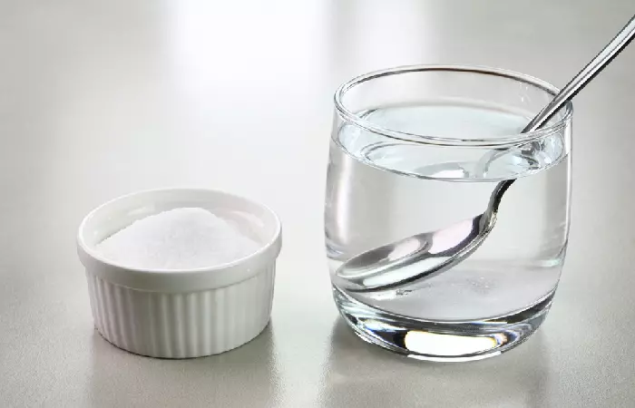 Salt water in a glass for cleaning a cyber bites piercing