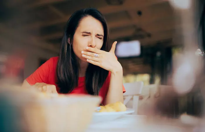 Woman having a throbbing pain while eating due to infected tongue piercing
