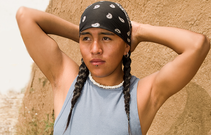 A Native American man with facial piercings