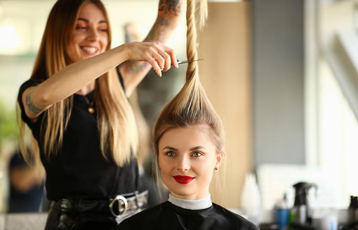 Woman getting a hush cut