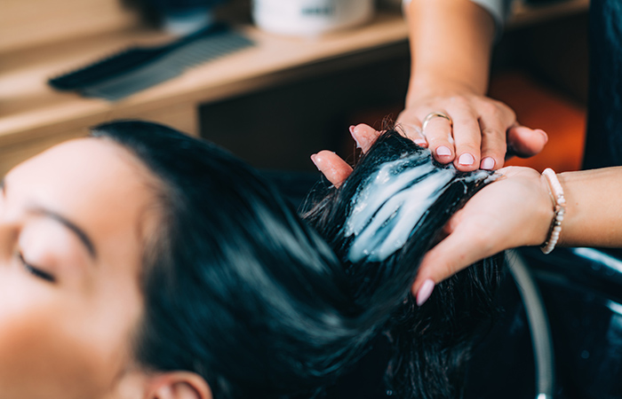 Woman getting her hair conditioned