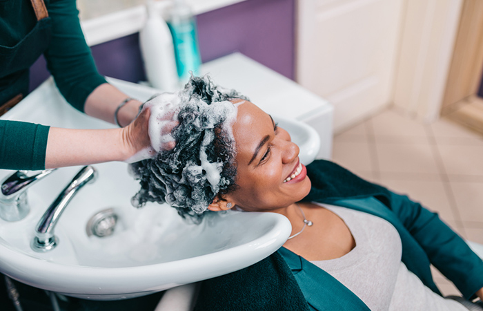 Woman getting her hair washed