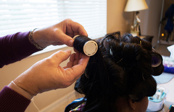 Woman in hair rollers