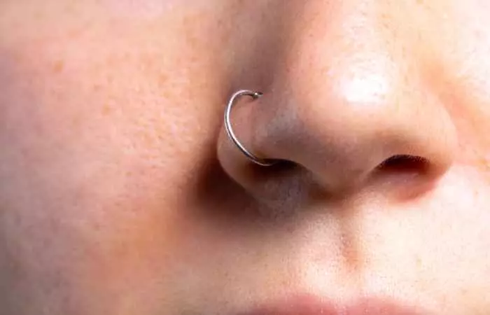 Woman with a healed nose piercing