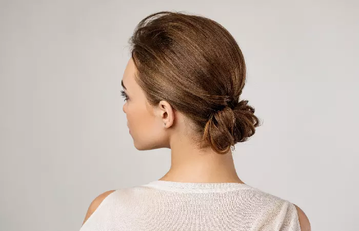 Woman with a low messy bun