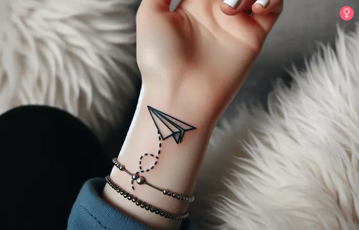 Paper airplane tattoo