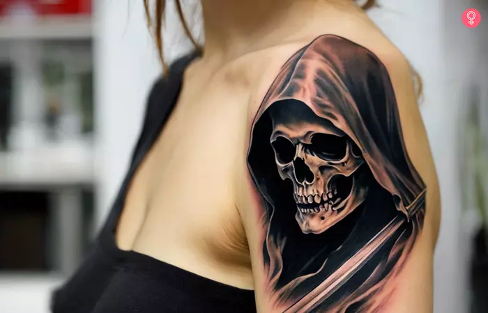 Realistic Grim Reaper tattoo on a woman’s upper arm