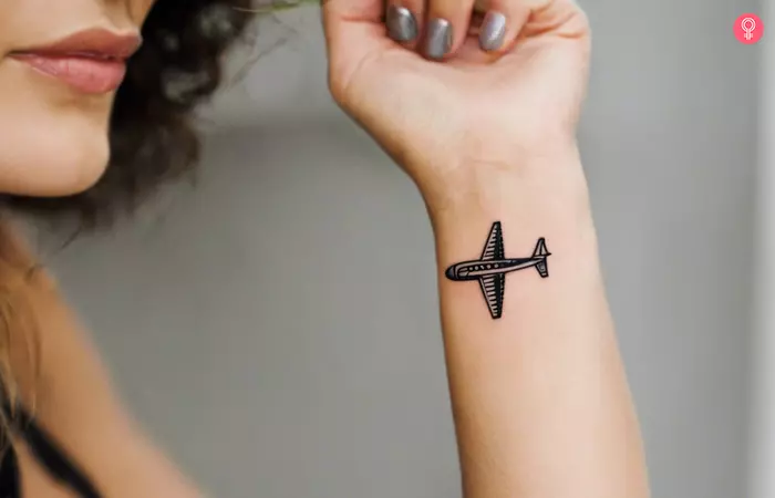 Small airplane tattoo