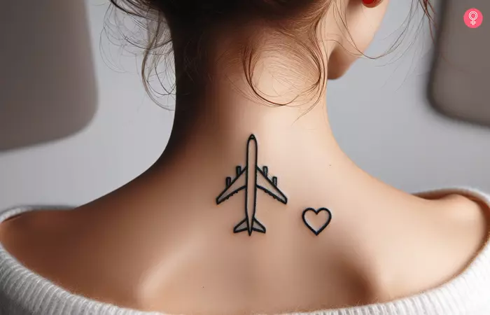 Airplane heart tattoo on a woman’s back